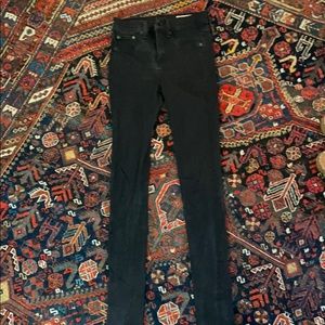 Worn black skinny jeans